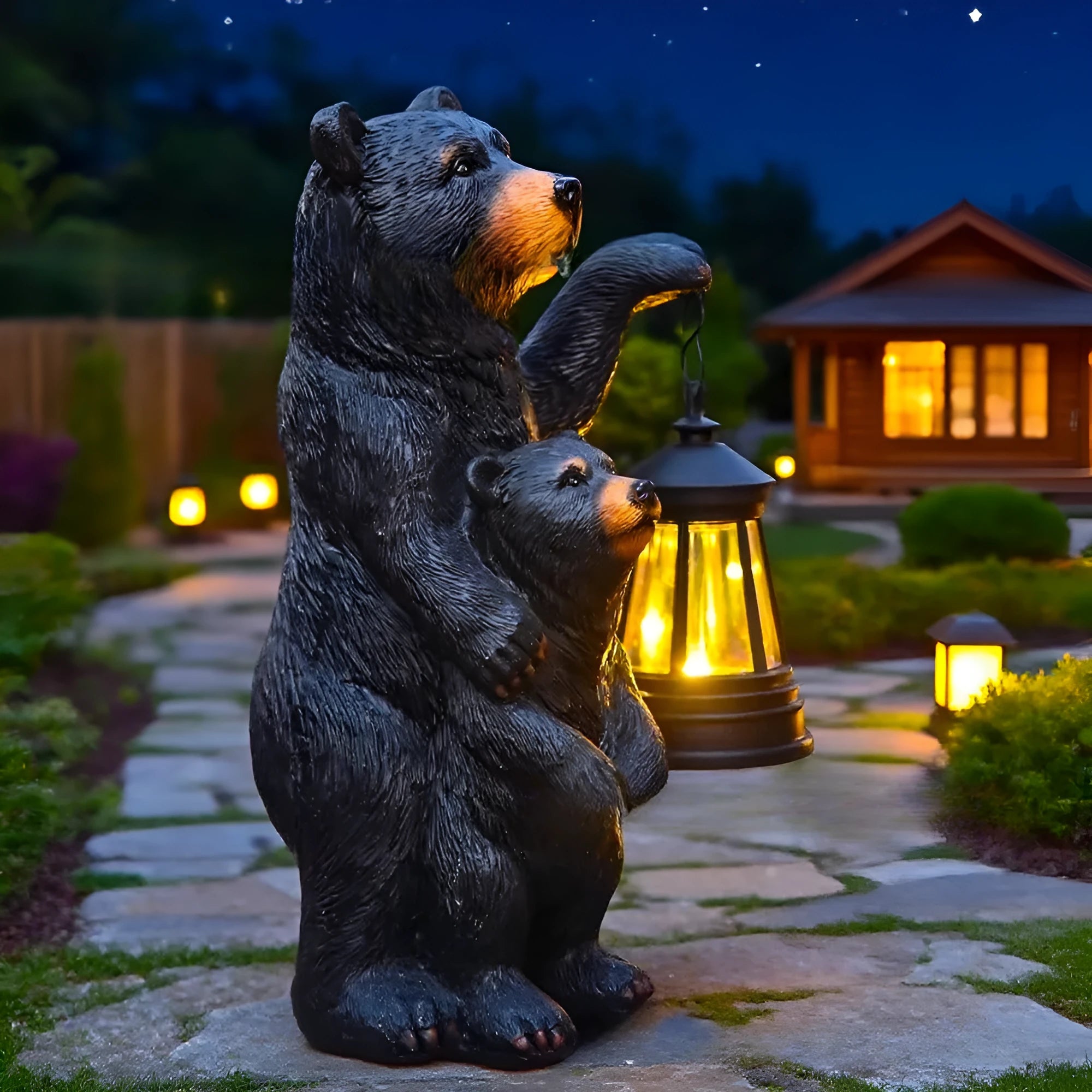 Resin black bear mother and child lantern ornament on a wooden shelf with soft glow