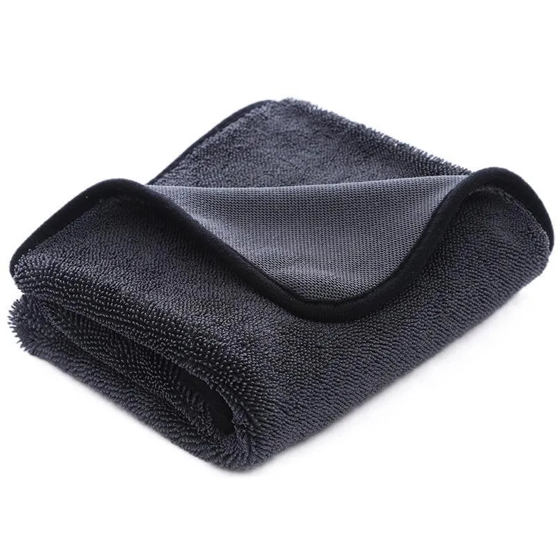 Small braid twisted car cleaning towel in grey with red edge trim, showing textured surface