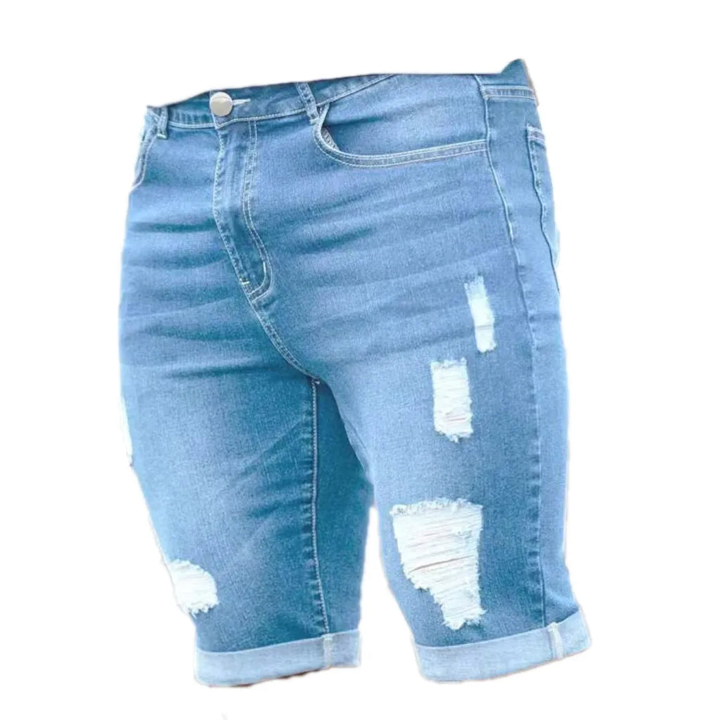 Sky blue men's denim shorts with multi-hole distressed design and low waist straight cut