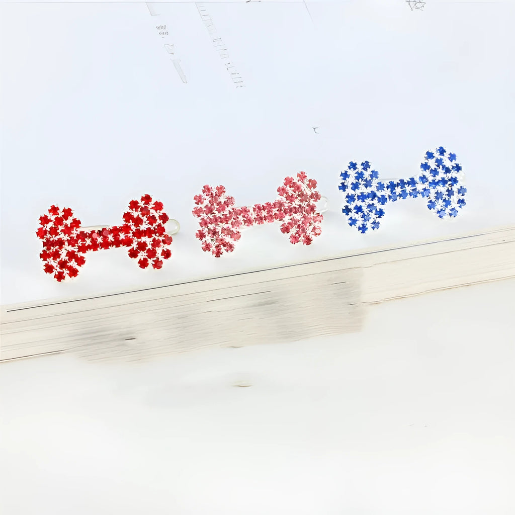Dog bone pet barrette in size S with diamond accent, shown in white, pink, blue, and red colour options