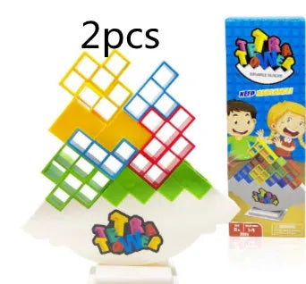 Plastic balance stacking game with 16 coloured blocks, chassis, and base on a table.