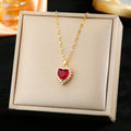 Gold red titanium steel necklace with heart and flower pendant, matching earrings, and ring.