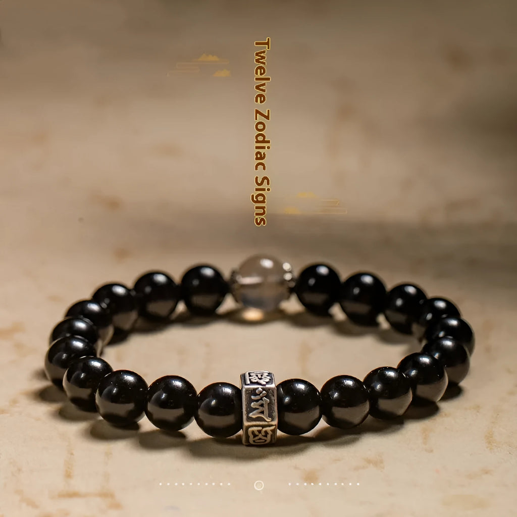 Obsidian bracelet with carved Chinese zodiac animal design, ethnic style, 8mm thick.