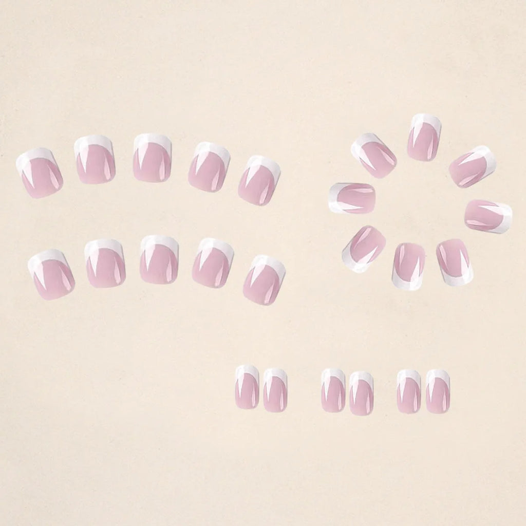24 white plaid-patterned plastic fake nail tips arranged showing design detail