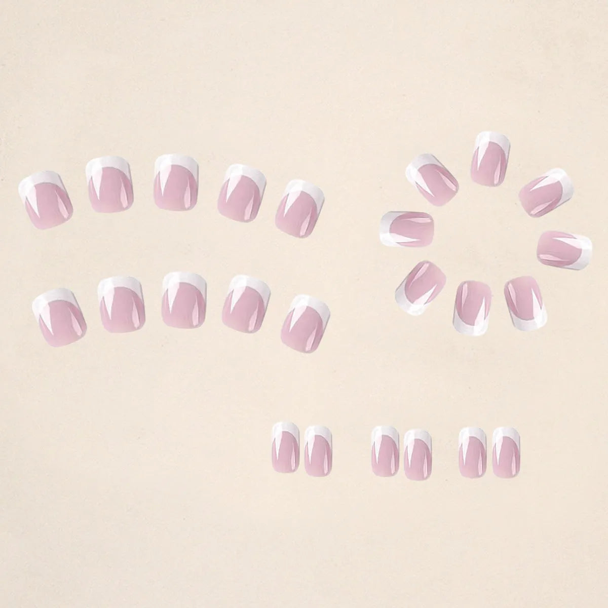 24 white plaid-patterned plastic fake nail tips arranged showing design detail