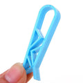 Polypropylene garbage bag fixing clip for holding bin liners securely to trash can sides.