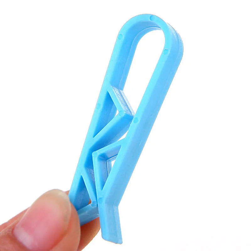 Polypropylene garbage bag fixing clip for holding bin liners securely to trash can sides.