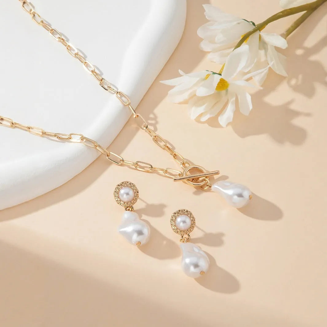 Gold tone retro baroque pearl jewellery set showing necklace and matching earrings