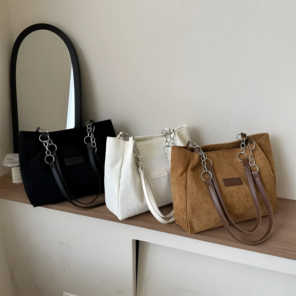 Corduroy one-shoulder tote bag with three-dimensional front pocket in street style design