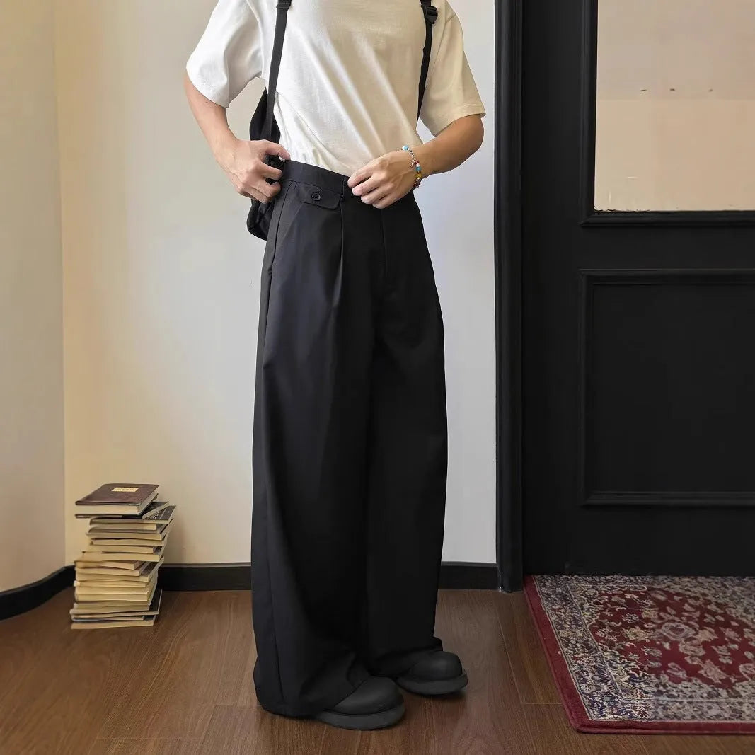 Men's brown straight-leg wide drape casual trousers laid flat