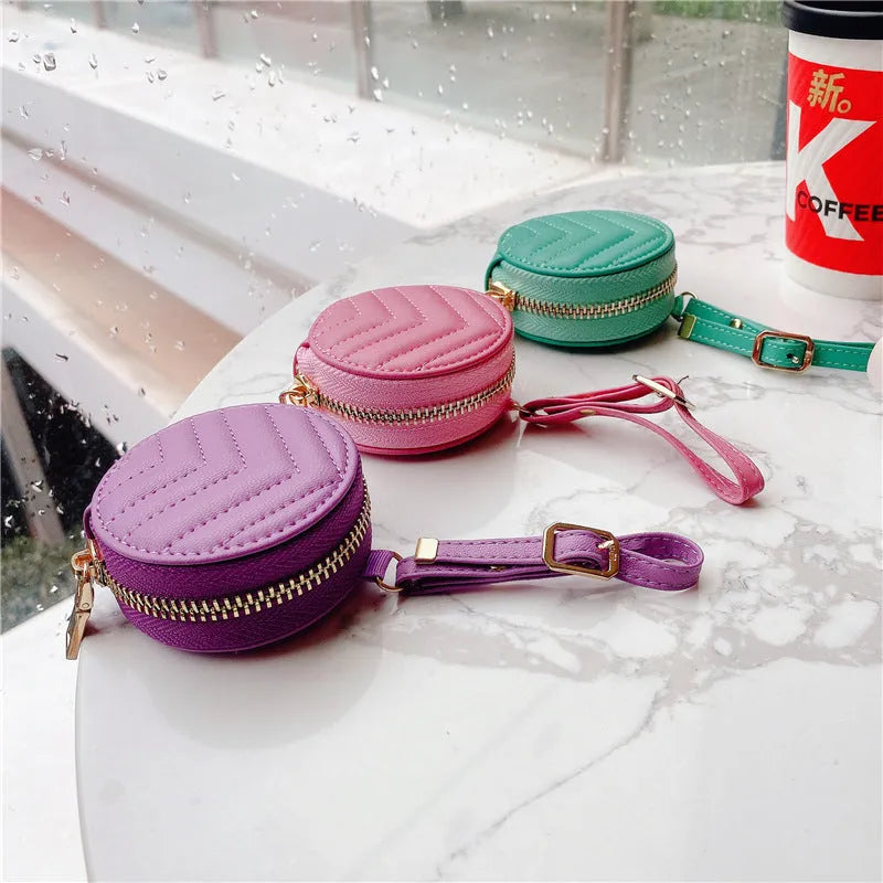 Wallet-style Bluetooth headset protective case with zipper and imitation leather finish in green, pink, red, purple, or black.