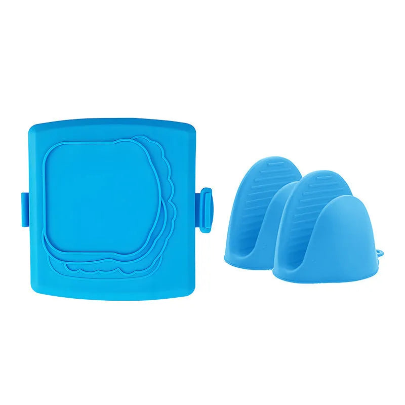 Red silicone baking tray with matching anti-scald gloves on kitchen counter