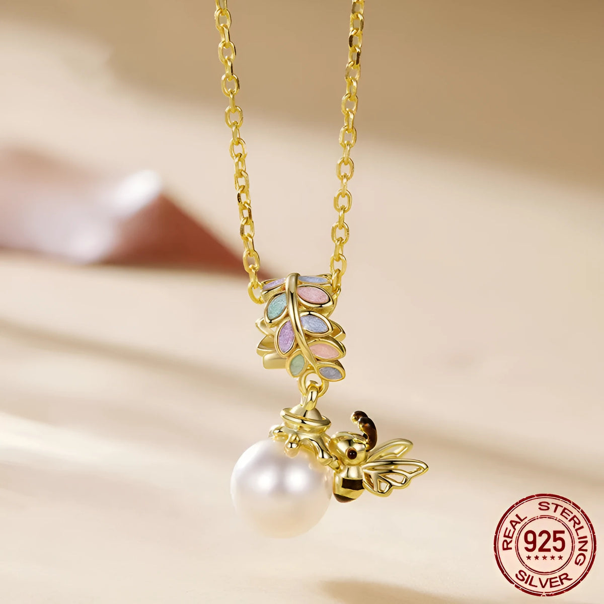 S925 sterling silver gold plated bee pendant with pearl accent, 2.1cm high, 1.4cm wide, 0.45cm aperture