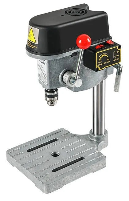 Bench drilling and milling machine with cross bench pliers and heavy duty bench pliers on a workshop table