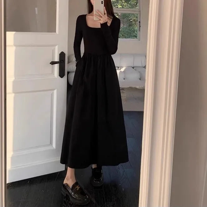 Women's black square collar knitted A-line dress with long sleeves and elastic waist.