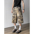 Yellow snake pattern camouflage cropped jeans on a model.