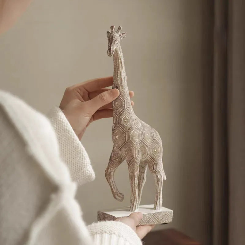 Wood colour European style synthetic resin giraffe decorative ornament on a white background.