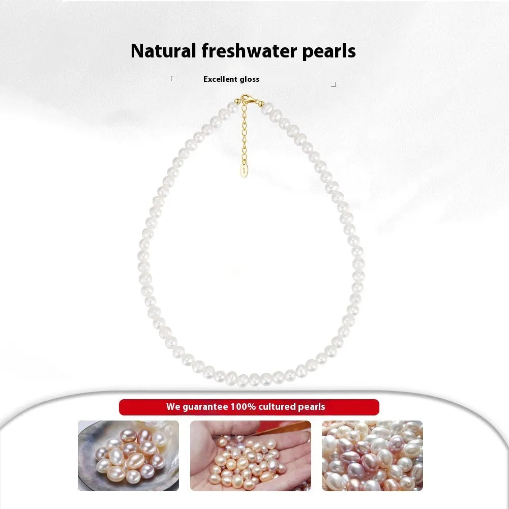 Women's simple sterling silver necklace with round freshwater pearls on an adjustable chain.