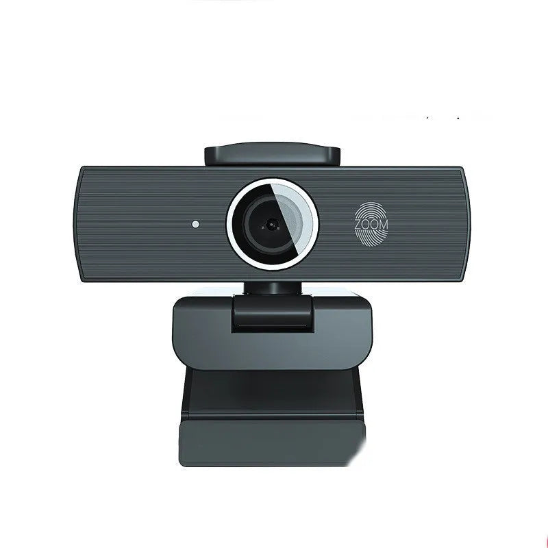Black 8MP USB webcam with magnetic privacy cover on desktop