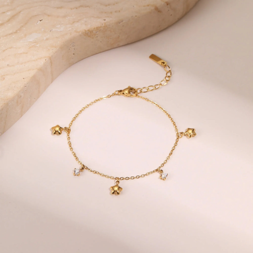 Titanium steel bracelet with 18K gold plating and geometric zircon star pendant