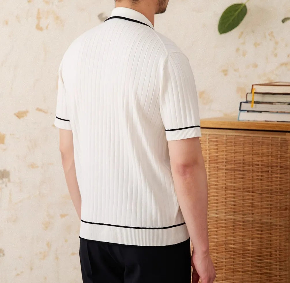 Slim-fit black lapel short-sleeved polo shirt on a hanger, showing collar detail.