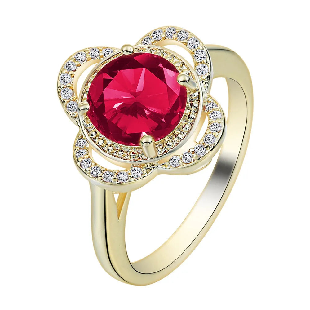 Copper fruit-shaped ring with inlaid zircon gemstones on a model's finger.