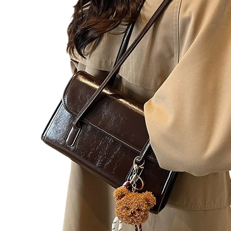 Women's brown PU Maillard shoulder bag with pendant showing horizontal square shape and dual straps