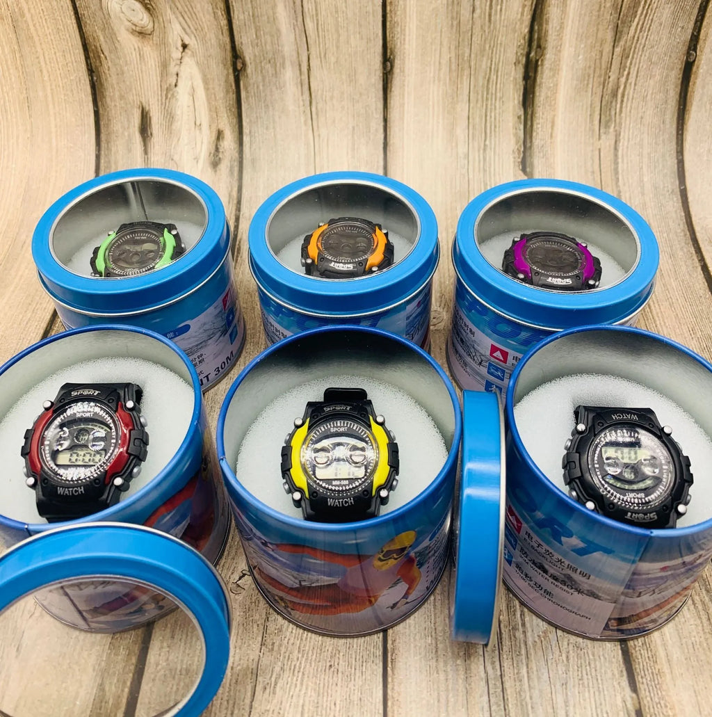 Digital sports watch for children with large face, silicone strap, and display showing time and date.