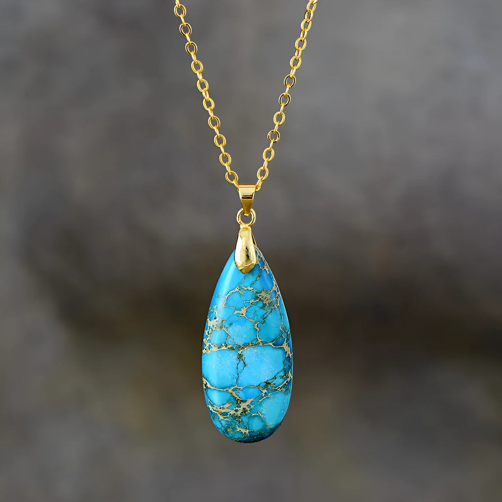 Emperor stone jade water drop pendant necklace with 18K gold plated chain on display.
