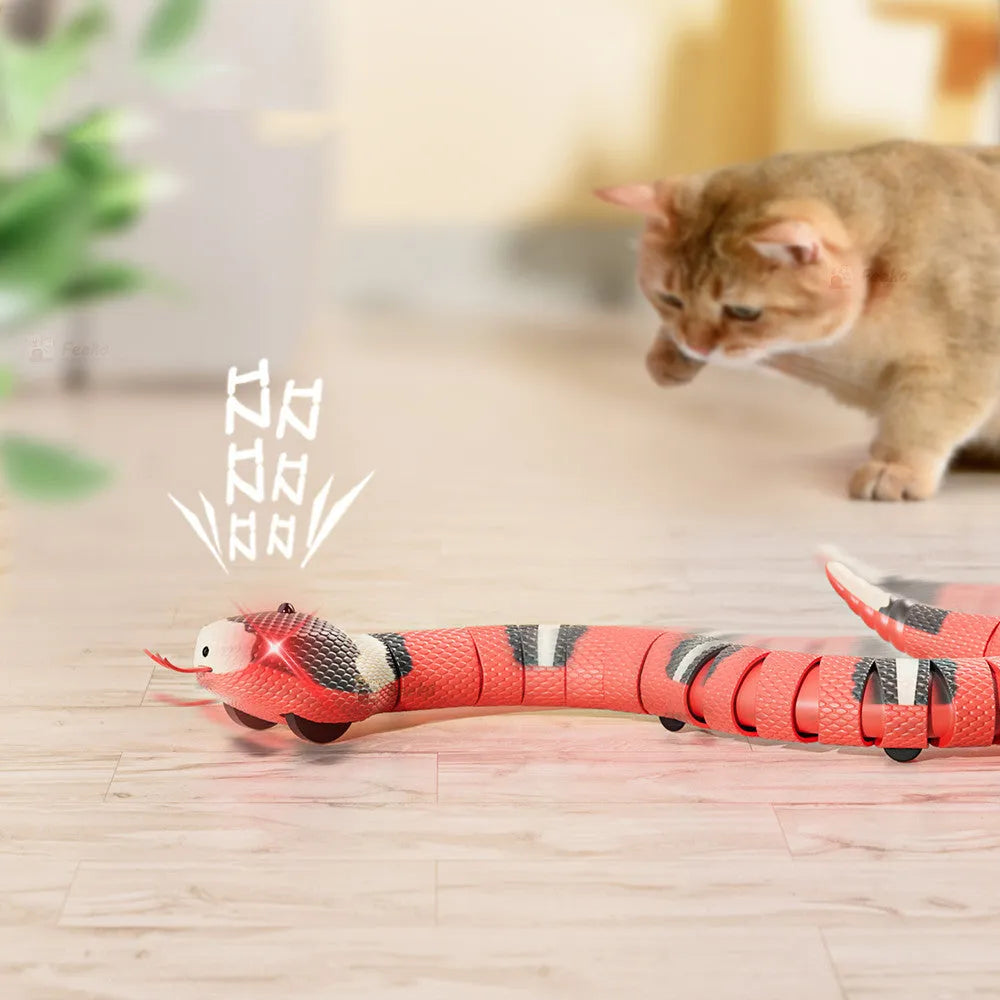 Tricky interactive sleeping electric induction snake toy in plastic, 40cm long, realistic snake prop for pranks.