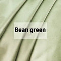 Double-sided silk duvet cover showing reversible solid colours in lotus pink and pea green options
