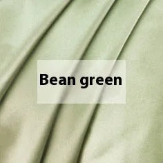 Double-sided silk duvet cover showing reversible solid colours in lotus pink and pea green options