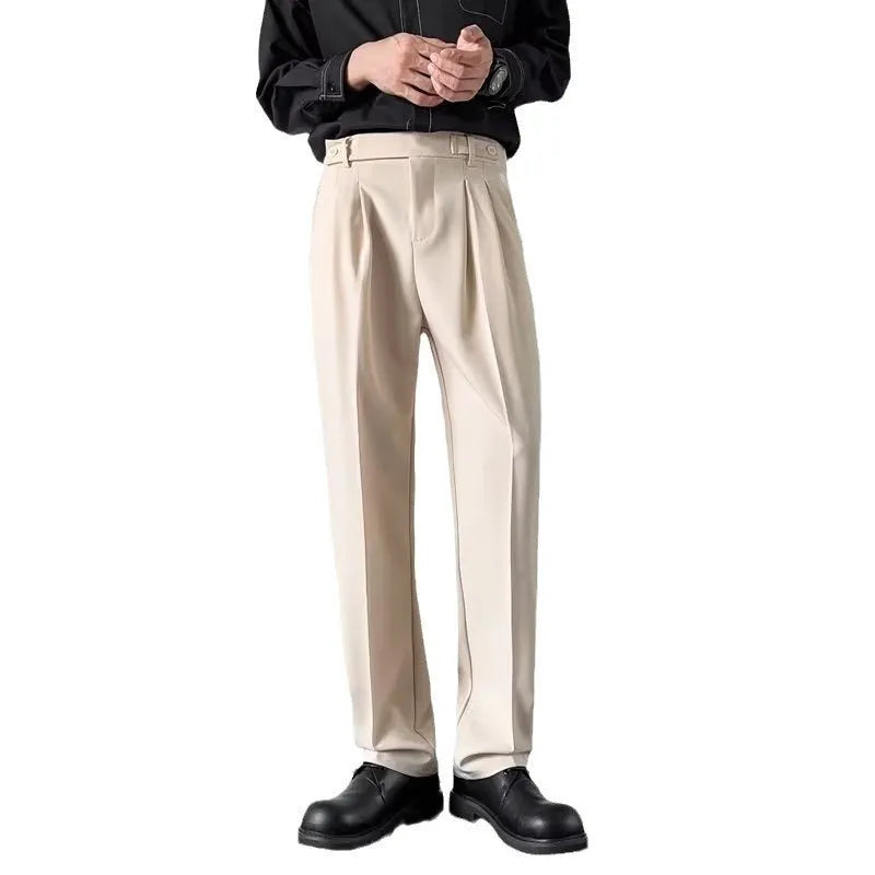 Apricot and black men's straight loose-fit suit trousers on a hanger.