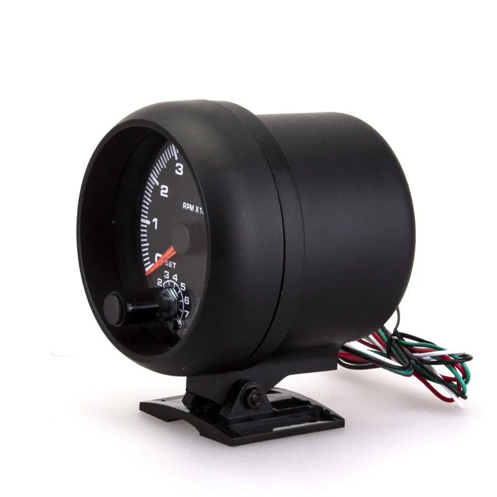 Black universal car tachometer with blue pointer on dial showing 0-8000 RPM range.