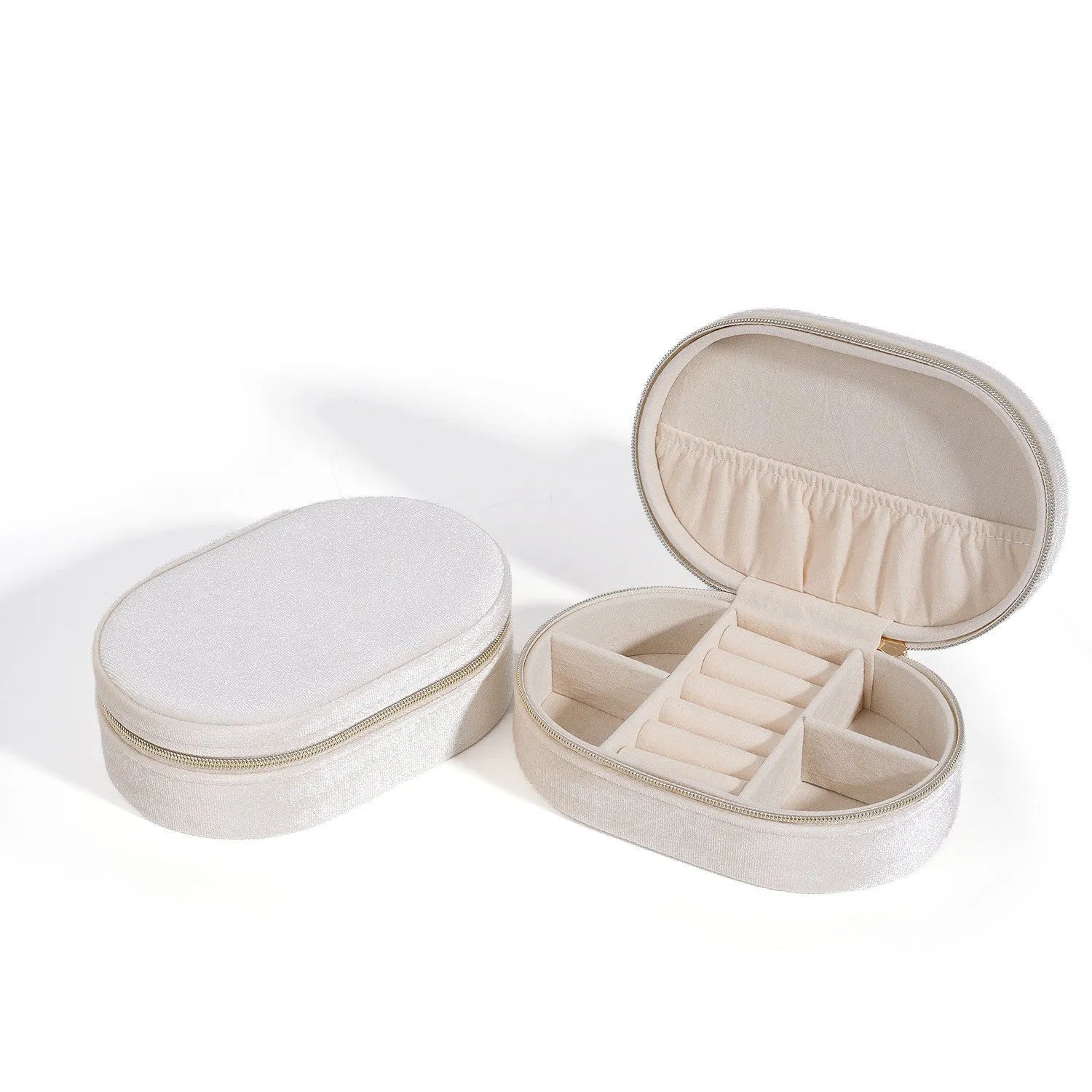 Oval velvet jewellery storage box in assorted colours with flannel lining, showing 15cm by 10cm dimensions.