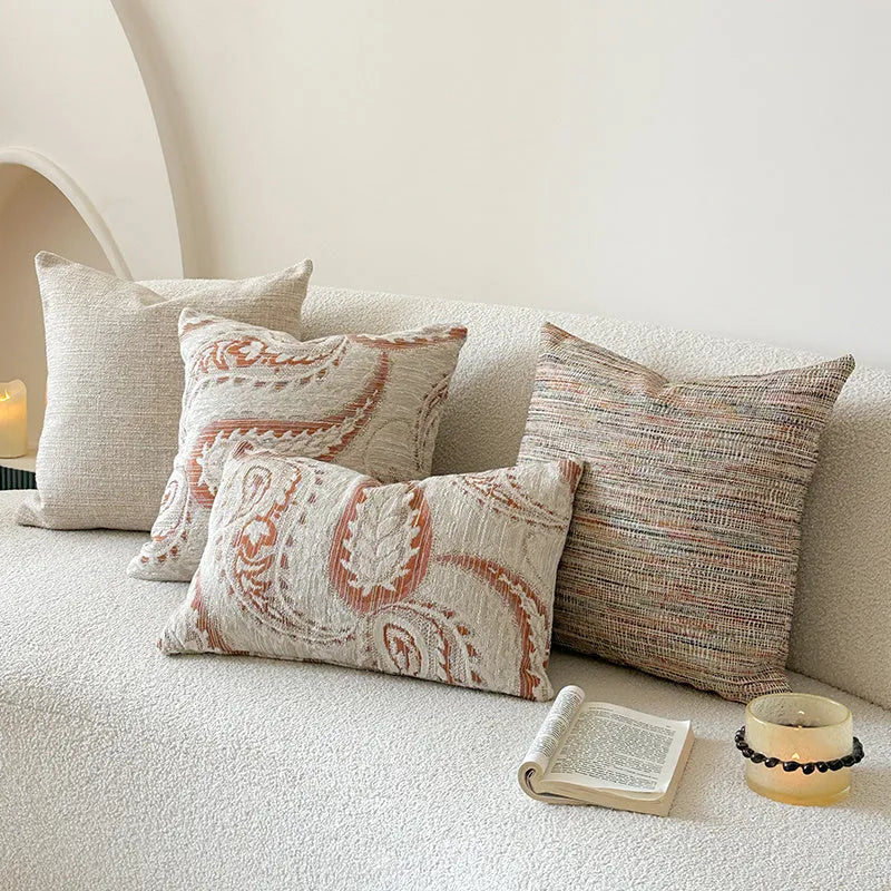 American-style yarn-dyed jacquard pillow cover with paisley pattern in amber colours on sofa