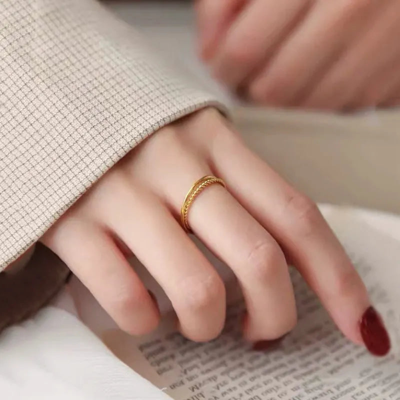 Gold plated brass women's ring shown in twist, simple bracelet glossy, and simple bracelet matte styles.