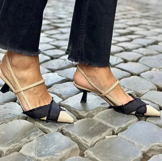 Women's apricot and black colour block stiletto heel sandals with pointed toe and buckle fastening.