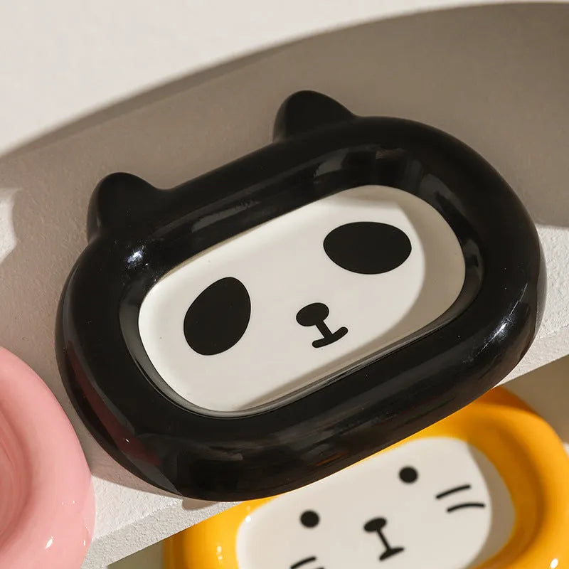 Ceramic pet bowl sculpted like an animal with a slanted interior for food, shown in a choice of colours.