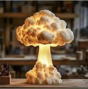 Atomic bomb explosion mushroom cloud shaped USB table lamp on a desk.