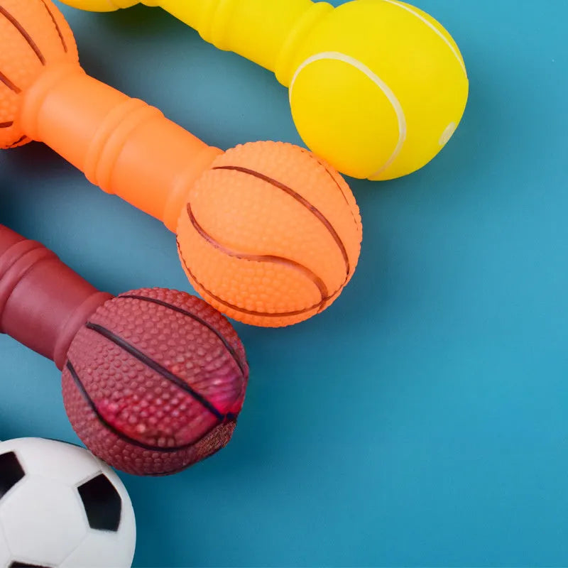 Brown, orange, white and yellow PVC football dumbbell dog toy with squeaker.