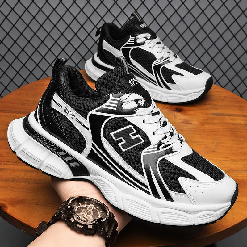 Men's black mesh running shoes with injection moulded plastic sole and round toe