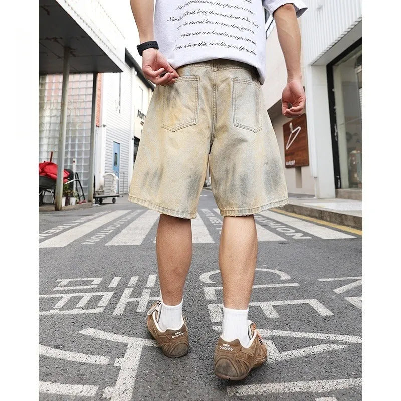Light blue distressed denim shorts for men with straight-leg cut and mid-waist fit