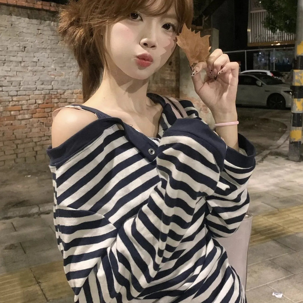 Dark blue Korean-style oversized women's long-sleeved t-shirt with stripes and embroidery detail.