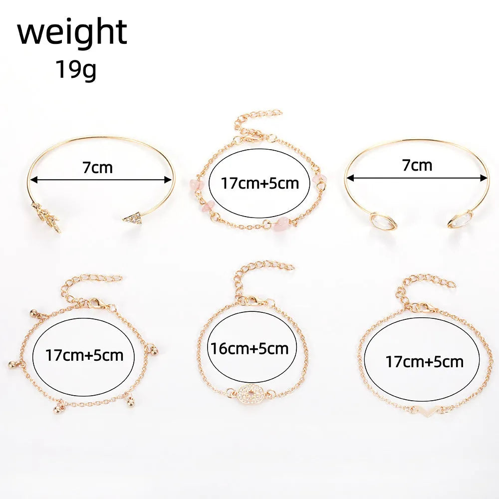 Gold-coloured six-piece bracelet set with arrow and water drop shapes featuring spot drill detailing