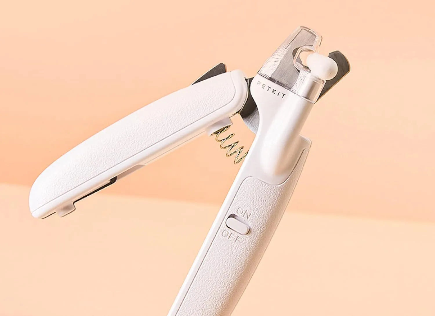 White LED pet nail clipper with transparent anti-splash guard and nail file.