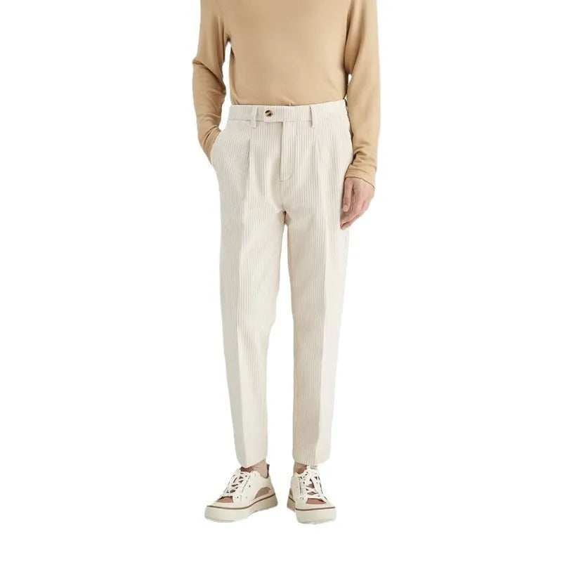 Men's straight-leg corduroy trousers in beige, showing loose fit and textured fabric