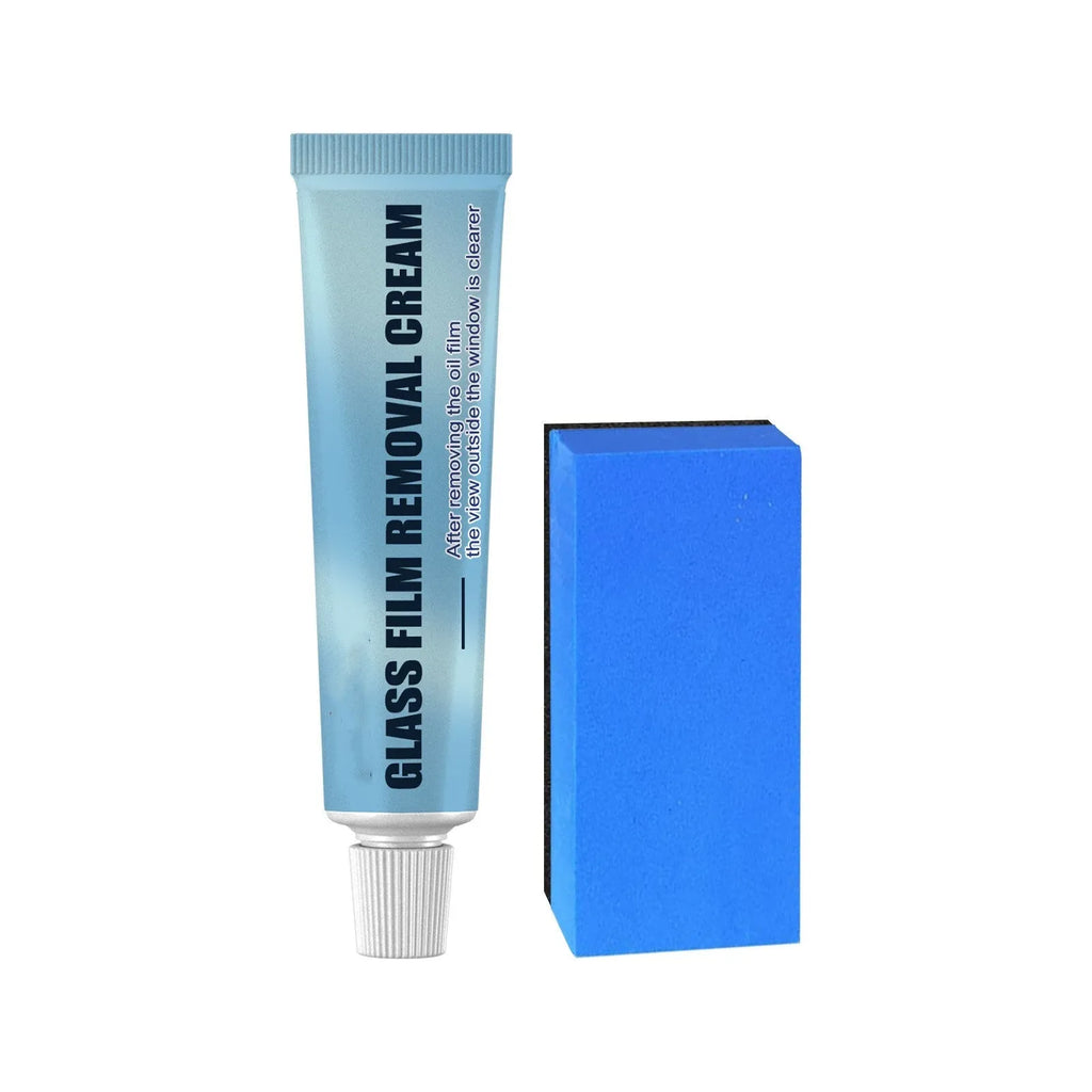 Blue sponge and bottle of car glass oil film remover cleaner on a car windscreen.
