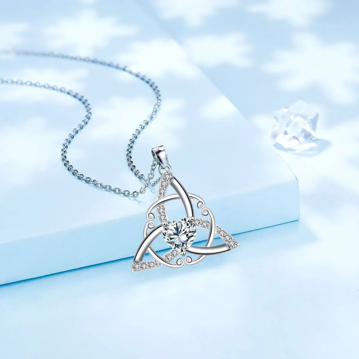 Geometric Celtic knot women's necklace in electroplated copper, shown in one of four colour options.
