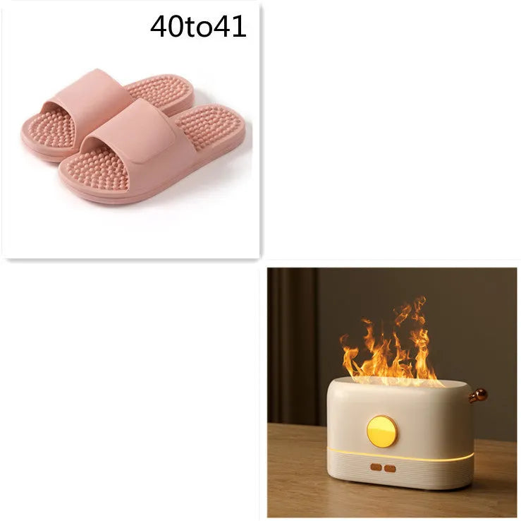 Black USB desktop humidifier with glowing simulated flame effect and water mist output.